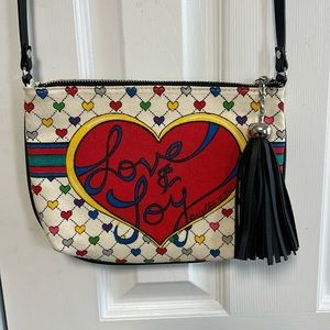 Brighton Tom Clancy Love & Joy Canvas Crossbody Bag with tassel.